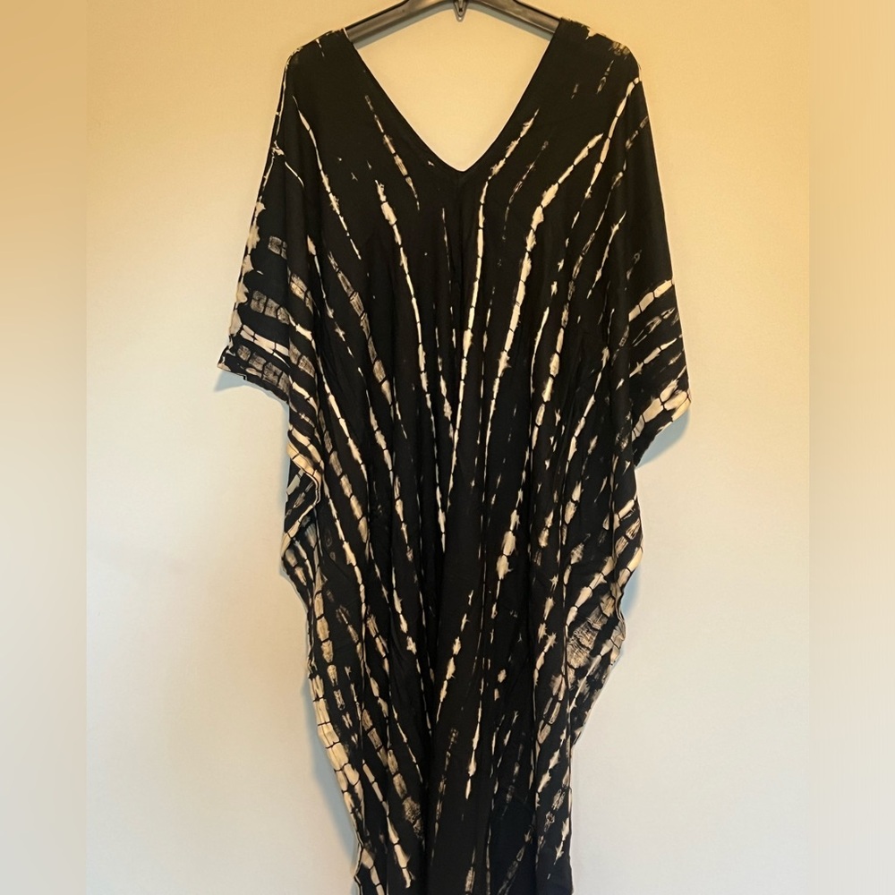 Swimwear coverup black and tan. Never worn. One size fits all.